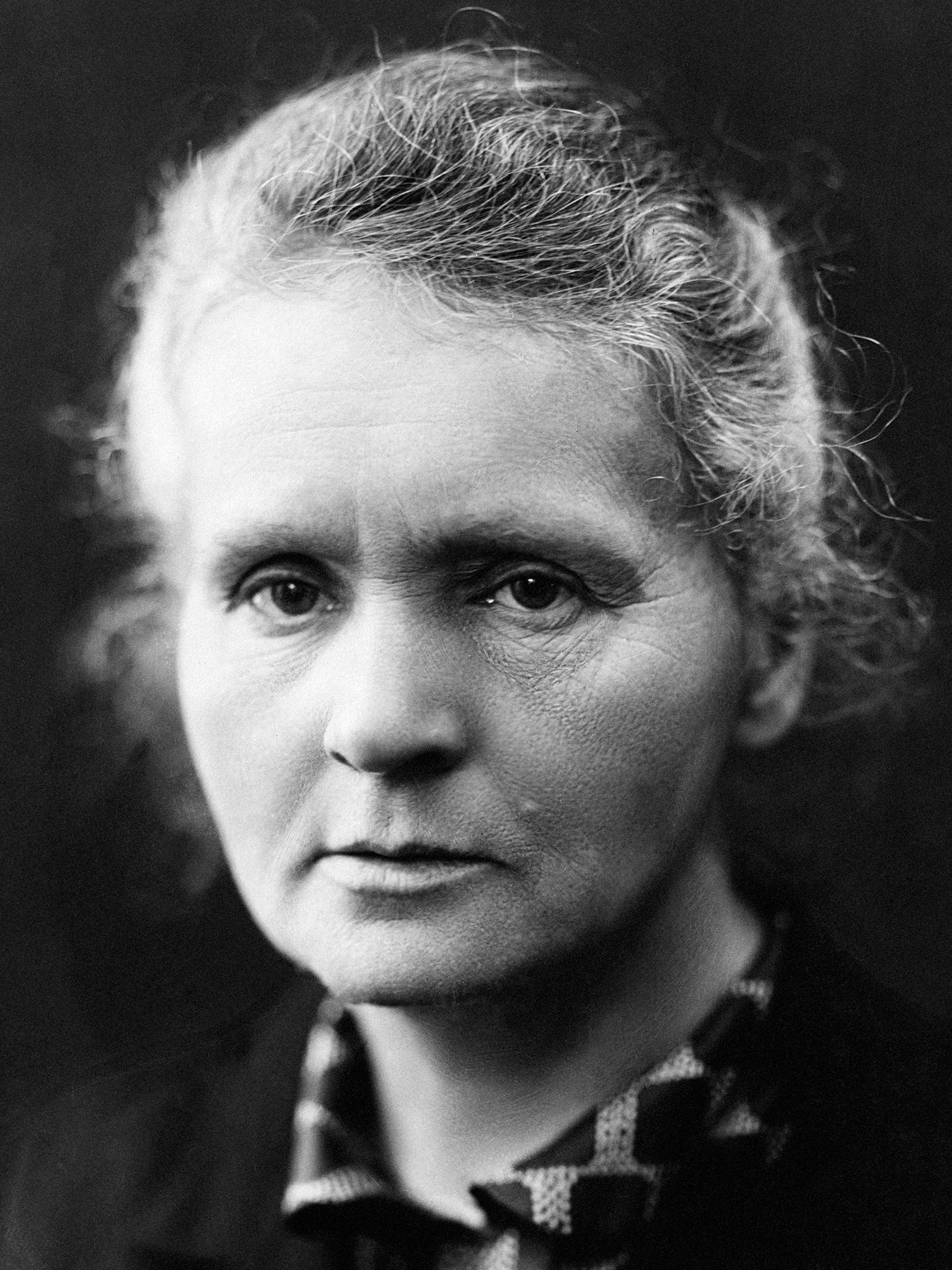 ca. 1926, France --- Portrait of physicist Madame Marie Curie. She was the first woman to be awarded the Nobel Prize for physics for the work on radioactive elements with her husband Pierre. --- Image by © Hulton-Deutsch Collection/CORBIS