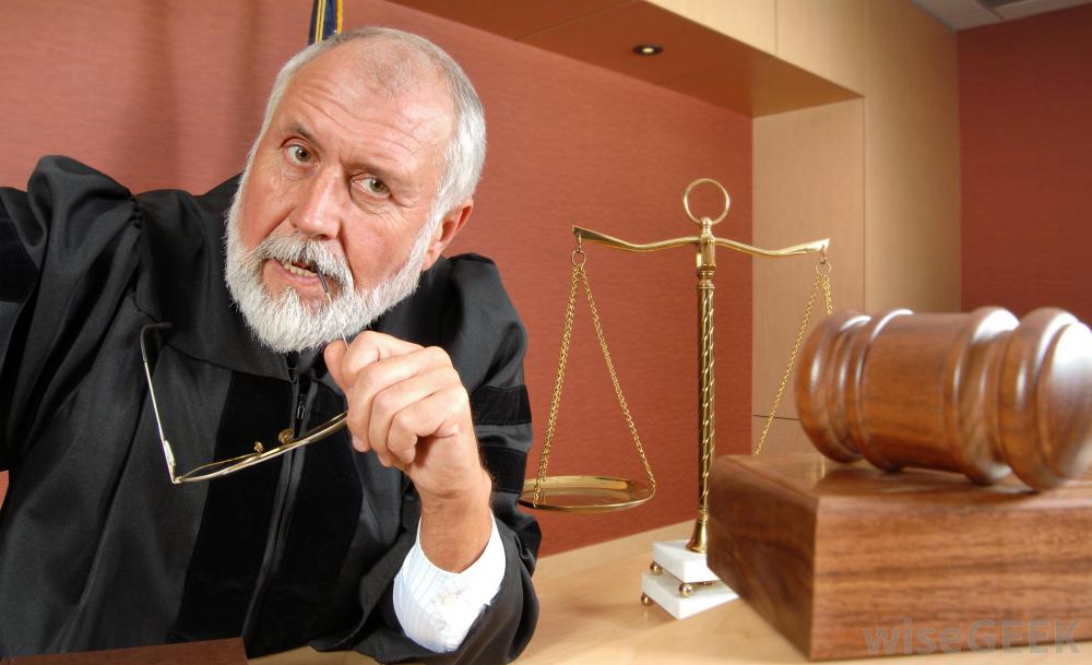 male-judge-with-glasses-gavel-and-scale